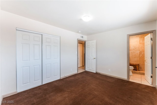 704 N Wallace Dr, Las Vegas, NV 89107 - unfurnished bedroom featuring a closet, carpet floors, and ensuite bath