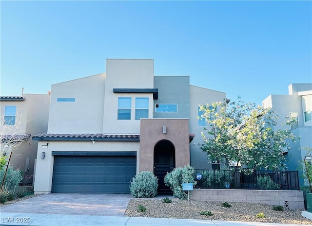 6230 Bravestar Ct, Las Vegas, NV 89141 - view of front of house with stucco siding, a garage, and decorative driveway