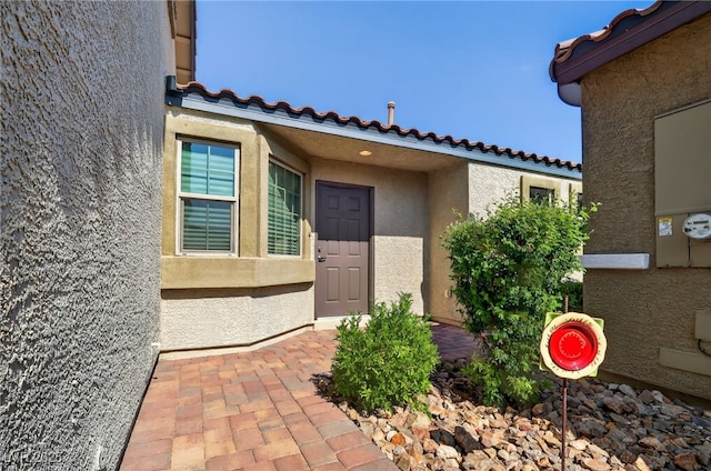 2175 Limestone Cove Ct, Laughlin, NV 89029 - property entrance with stucco siding and a tiled roof
