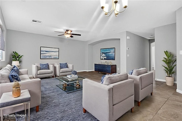 2175 Limestone Cove Ct, Laughlin, NV 89029 - tiled living room with a ceiling fan and a chandelier