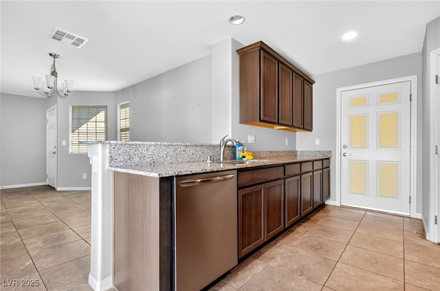 2175 Limestone Cove Ct, Laughlin, NV 89029 - kitchen featuring dishwasher, light tile patterned flooring, a chandelier, light stone counters, and dark brown cabinetry