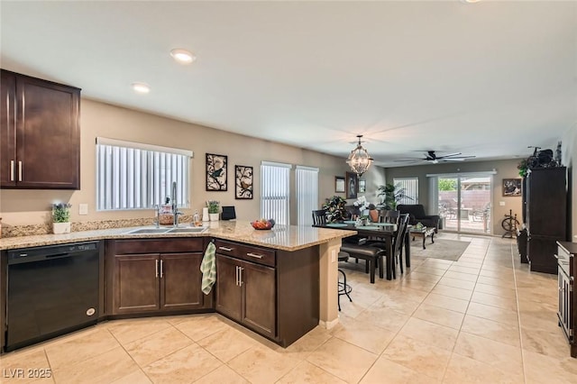 7224 Piute Mesa St, North Las Vegas, NV 89084 - kitchen with black dishwasher, dark brown cabinets, a peninsula, light tile patterned flooring, and recessed lighting