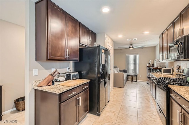 7224 Piute Mesa St, North Las Vegas, NV 89084 - kitchen featuring black appliances, a ceiling fan, dark brown cabinets, recessed lighting, and light stone countertops