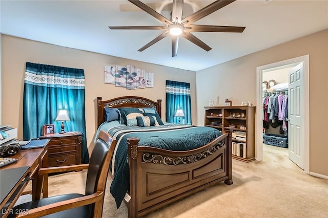 7224 Piute Mesa St, North Las Vegas, NV 89084 - bedroom featuring light colored carpet, a spacious closet, a desk, ceiling fan, and a closet