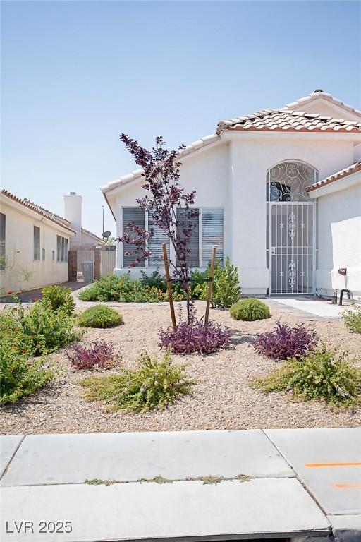 5233 Camino Del Rancho, Las Vegas, NV 89130 - mediterranean / spanish-style house featuring stucco siding and a tile roof