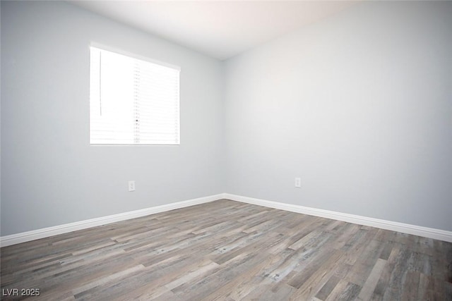 5233 Camino Del Rancho, Las Vegas, NV 89130 - unfurnished room featuring wood finished floors and baseboards