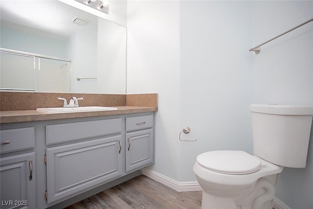 5233 Camino Del Rancho, Las Vegas, NV 89130 - bathroom with vanity, wood finished floors, and a shower