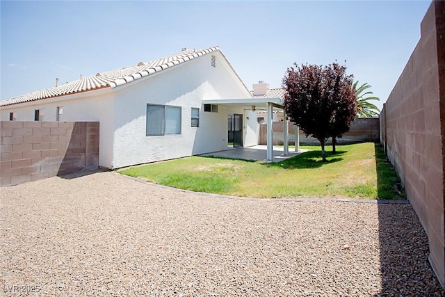 5233 Camino Del Rancho, Las Vegas, NV 89130 - back of house featuring a patio, a fenced backyard, stucco siding, and a ceiling fan