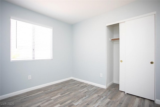 5233 Camino Del Rancho, Las Vegas, NV 89130 - unfurnished bedroom with wood finished floors and a closet