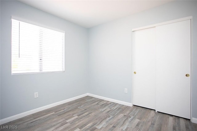 5233 Camino Del Rancho, Las Vegas, NV 89130 - unfurnished bedroom featuring wood finished floors and a closet