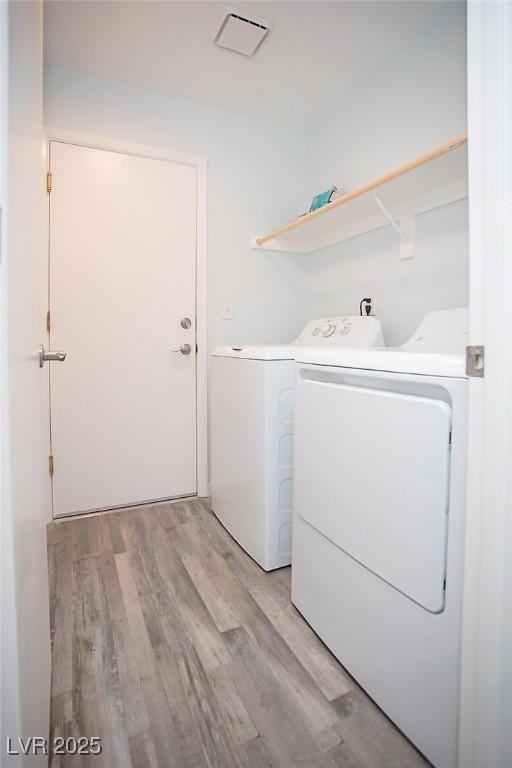 5233 Camino Del Rancho, Las Vegas, NV 89130 - laundry area with washer and dryer and light wood-type flooring
