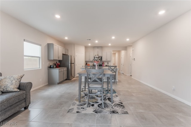 7910 Shimmery St, North Las Vegas, NV 89084 - dining area with recessed lighting and light tile patterned floors