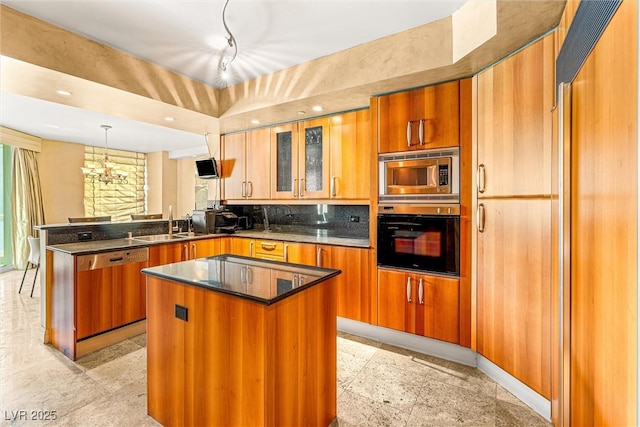 2877 Paradise Rd Unit 702, Las Vegas, NV 89109 - kitchen with black oven, dishwashing machine, stainless steel microwave, a peninsula, and brown cabinets