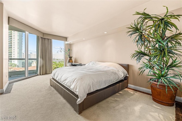 2877 Paradise Rd Unit 702, Las Vegas, NV 89109 - carpeted bedroom featuring a city view and access to outside