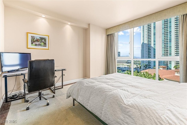2877 Paradise Rd Unit 702, Las Vegas, NV 89109 - bedroom featuring a city view, a desk, and recessed lighting