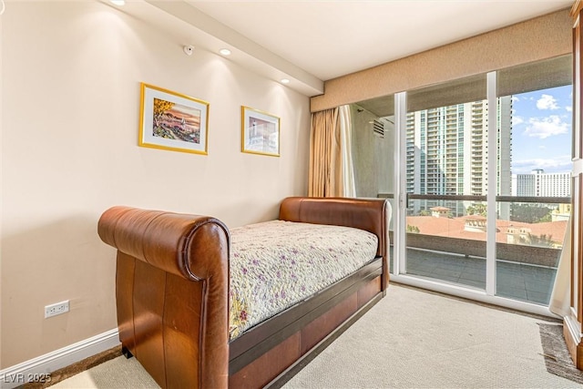 2877 Paradise Rd Unit 702, Las Vegas, NV 89109 - carpeted bedroom with access to exterior and recessed lighting