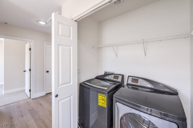 1097 Paradise Resort Dr, Henderson, NV 89002 - washroom with washing machine and dryer and light wood-style floors