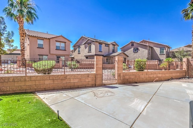 1097 Paradise Resort Dr, Henderson, NV 89002 - gate featuring a residential view and a fenced front yard