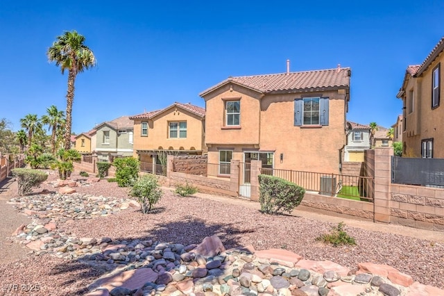 1097 Paradise Resort Dr, Henderson, NV 89002 - view of front of home featuring stucco siding, a tiled roof, and a residential view