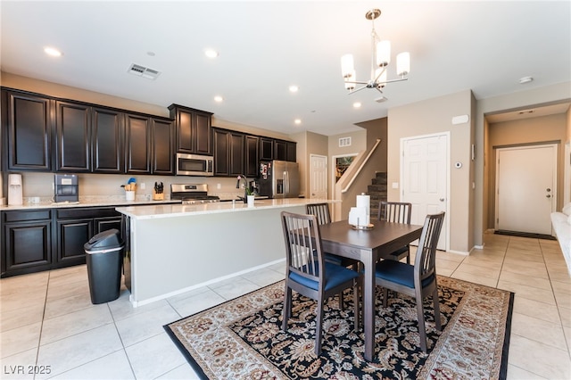 2861 Sunflower Days Ave Unit 1144, North Las Vegas, NV 89031 - dining space featuring stairway, a chandelier, light tile patterned flooring, and recessed lighting