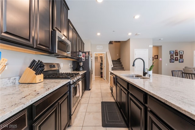 2861 Sunflower Days Ave Unit 1144, North Las Vegas, NV 89031 - kitchen featuring stainless steel appliances, light tile patterned flooring, light stone counters, and recessed lighting