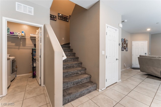 2861 Sunflower Days Ave Unit 1144, North Las Vegas, NV 89031 - stairs with washer and clothes dryer, tile patterned floors, and recessed lighting