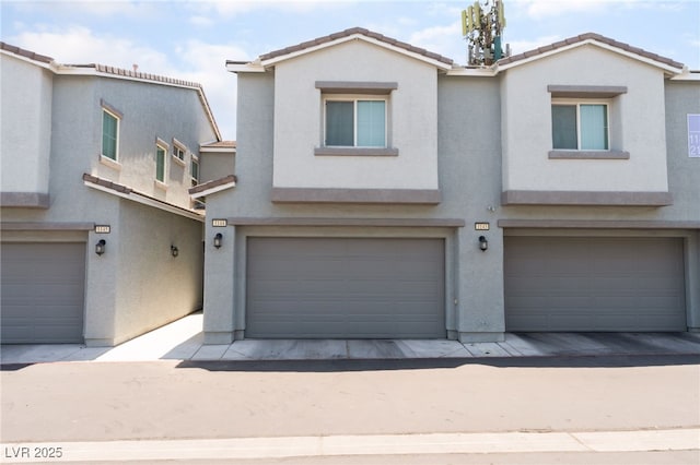 2861 Sunflower Days Ave Unit 1144, North Las Vegas, NV 89031 - multi unit property with stucco siding, a garage, and a tile roof