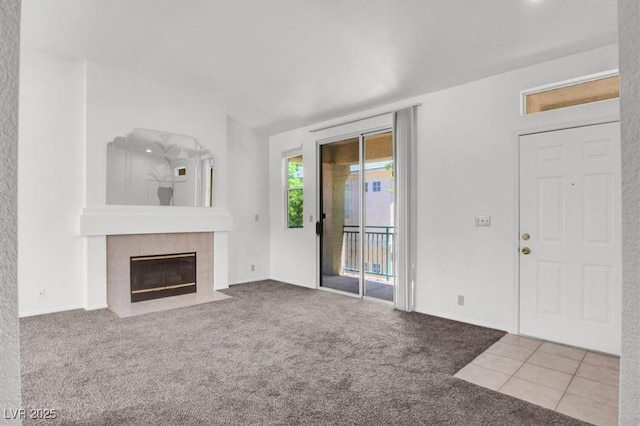 5155 W Tropicana Ave Unit 2017, Las Vegas, NV 89103 - unfurnished living room with carpet flooring and a tile fireplace
