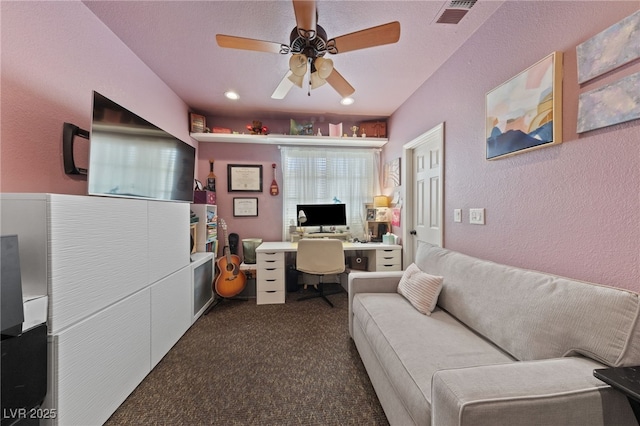 2637 Ohio Ct, Las Vegas, NV 89128 - office area with a textured wall, dark carpet, and a ceiling fan