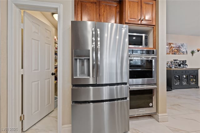 2637 Ohio Ct, Las Vegas, NV 89128 - kitchen with stainless steel appliances, light marble finish flooring, and brown cabinets