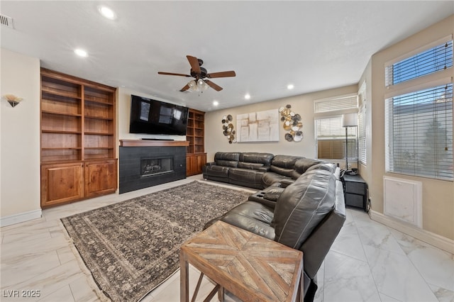 2637 Ohio Ct, Las Vegas, NV 89128 - living area featuring light marble finish floors, ceiling fan, a fireplace, and recessed lighting