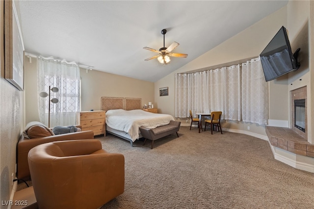 2637 Ohio Ct, Las Vegas, NV 89128 - carpeted bedroom with vaulted ceiling, a glass covered fireplace, and a ceiling fan