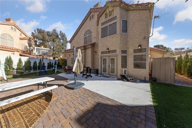 2637 Ohio Ct, Las Vegas, NV 89128 - rear view of property with french doors, stucco siding, and a patio