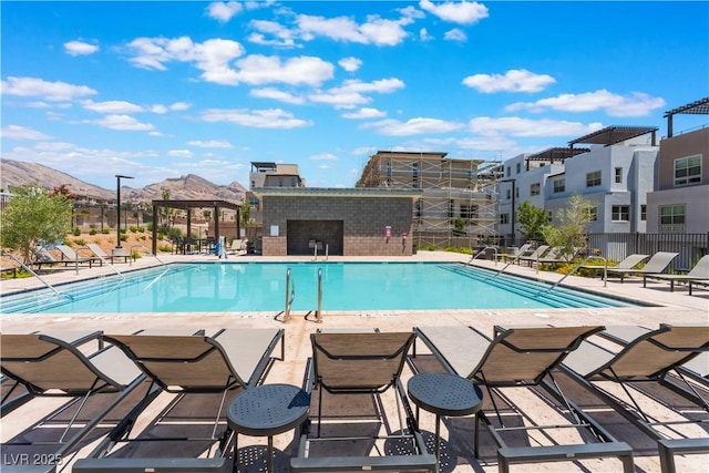 650 Agate Bridge St, Las Vegas, NV 89138 - community pool featuring a mountain view and a patio area