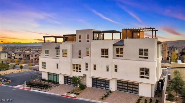 650 Agate Bridge St, Las Vegas, NV 89138 - view of building exterior with a garage and driveway