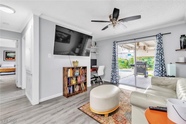 3499 Middlebury Ave, Las Vegas, NV 89121 - living room featuring wood finished floors, an office area, ornamental molding, and a ceiling fan