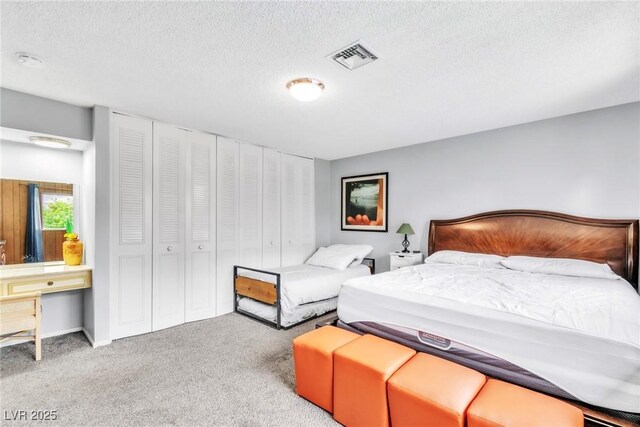 3499 Middlebury Ave, Las Vegas, NV 89121 - carpeted bedroom with a textured ceiling