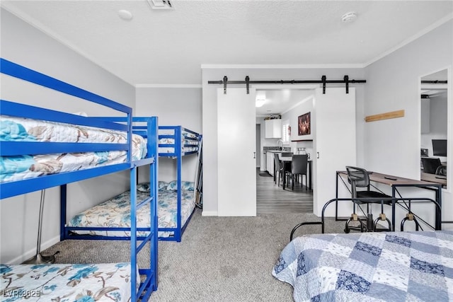 3499 Middlebury Ave, Las Vegas, NV 89121 - bedroom featuring carpet floors, crown molding, and a barn door