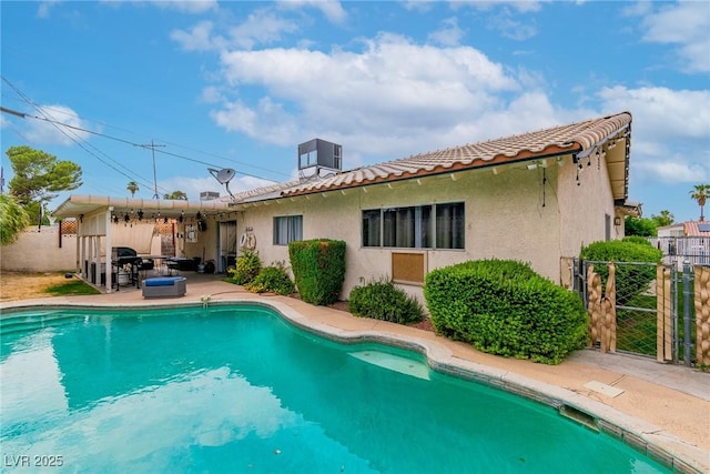 3499 Middlebury Ave, Las Vegas, NV 89121 - rear view of property with a tiled roof, stucco siding, a gate, and a patio area