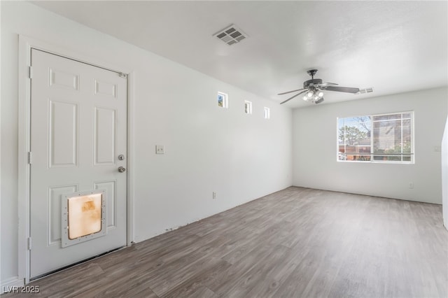 2149 Clancy St, Las Vegas, NV 89156 - empty room with wood finished floors and a ceiling fan
