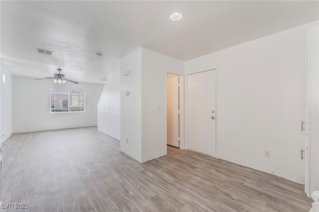 2149 Clancy St, Las Vegas, NV 89156 - unfurnished living room featuring light wood-style floors and ceiling fan