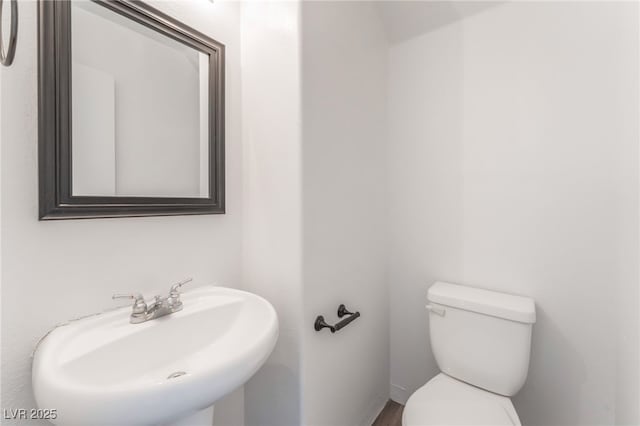 2149 Clancy St, Las Vegas, NV 89156 - half bathroom with a sink and wood finished floors