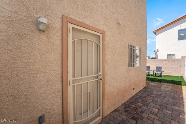 2149 Clancy St, Las Vegas, NV 89156 - entrance to property featuring stucco siding and a patio
