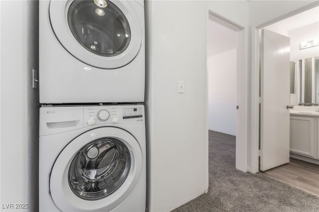 2149 Clancy St, Las Vegas, NV 89156 - laundry room with estacked washer and dryer and carpet