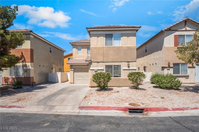 2149 Clancy St, Las Vegas, NV 89156 - view of front of home with stucco siding, driveway, a garage, and a tiled roof