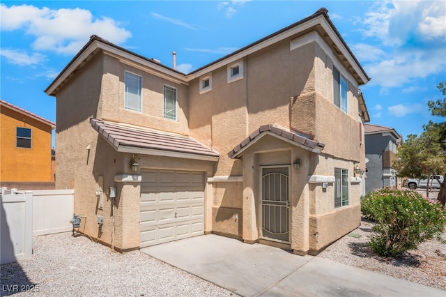 2149 Clancy St, Las Vegas, NV 89156 - view of front of home with an attached garage, concrete driveway, stucco siding, and a tile roof