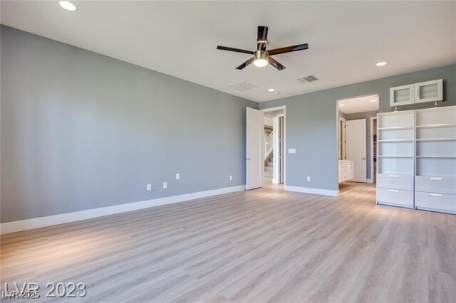 10342 Kesington Dr, Las Vegas, NV 89135 - unfurnished bedroom with recessed lighting, light wood finished floors, a spacious closet, connected bathroom, and ceiling fan
