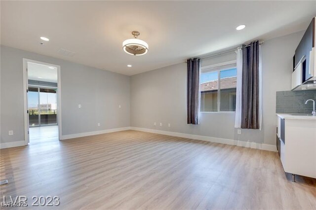 10342 Kesington Dr, Las Vegas, NV 89135 - unfurnished room featuring plenty of natural light, light wood finished floors, and recessed lighting