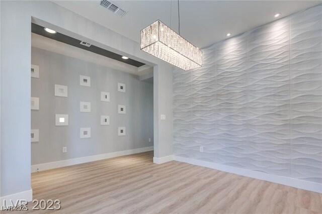 10342 Kesington Dr, Las Vegas, NV 89135 - empty room featuring wood finished floors, a chandelier, and recessed lighting