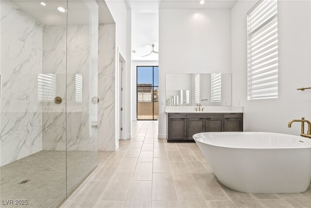 10919 Vista Altura Ave, Las Vegas, NV 89135 - full bathroom featuring a marble finish shower, a soaking tub, vanity, and recessed lighting